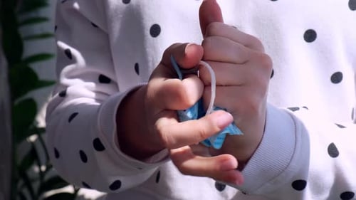 Hands Crumpling Blue Medical Face Mask Close Up
