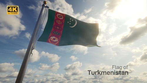 Waving Turkmenistan Flag Against Blue Sky with Sunlight