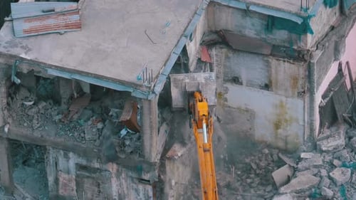Excavator Demolishing Building Aerial View
