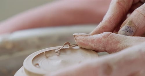 Hands Shaping Clay Bowl on Pottery Wheel