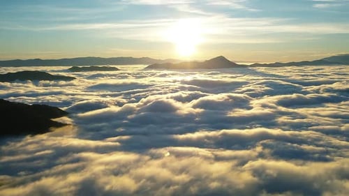 Aerial View of Clouds and Mountain at Sunrise