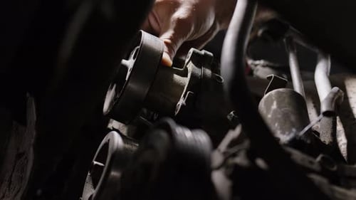 Close Up Shot of Removing Antifreeze Pump From Car Working Day in Car Service