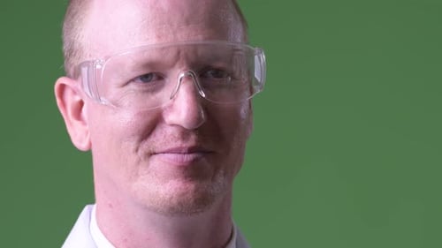 Man Wearing Safety Glasses and a Lab Coat