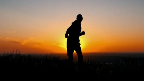 Silhouette Person Celebrating Fitness at Sunrise