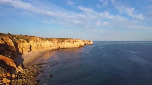 Aerial drone view of people on the beach during a beautiful sunset. Amazing vibrant colors