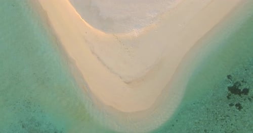 Aerial drone view of a scenic tropical island in the Maldives.