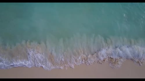 Aerial flying over landscape of tropical lagoon beach adventure by aqua blue lagoon with clean sandy