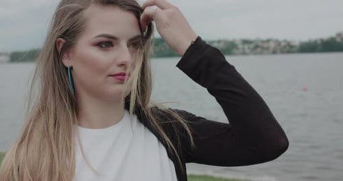 Young Woman Posing Fashionably by the Lake