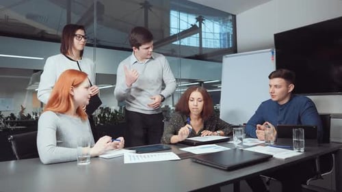 Business Team Brainstorming at Meeting in Office