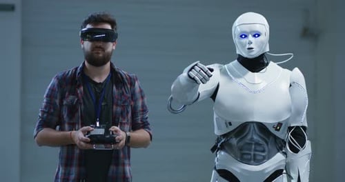Man Controls Humanoid Robot with Futuristic VR