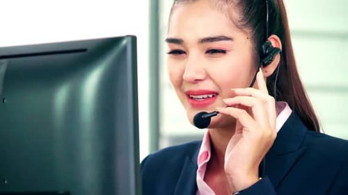 Business People Wearing Headset Working in Office
