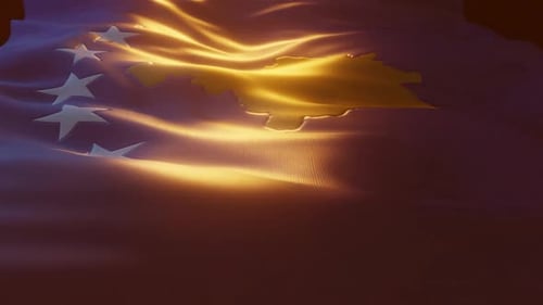 Waving Kosovo Flag with Dramatic Golden Light