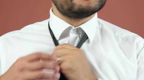 Man Untying Tie in a Close Up