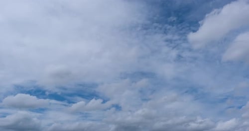Majestic Time-Lapse of Fluffy White Clouds in Blue Sky