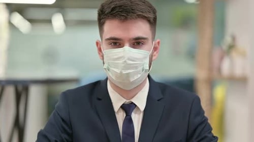 Young Adult Wearing Mask in Office Environment