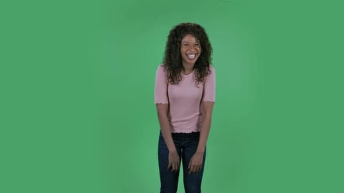 Smiling Woman Waving on Green Screen Background
