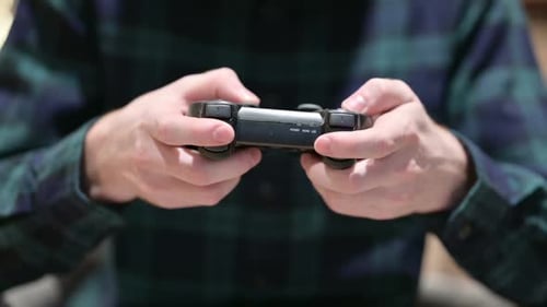 Close Up of Hands Playing on Video Game Controller