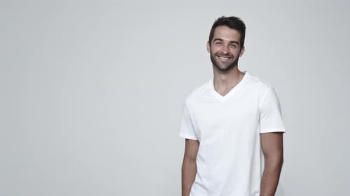 Smiling Man with Short Hair in Studio Setting