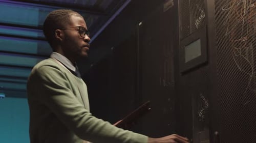 IT Engineer Checking on Server Room