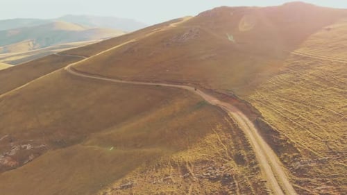 Motor Bike Riding on Grassy Mountain Road