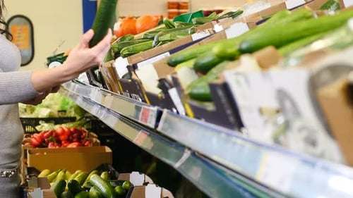 Closeup Shot of Young Woman Choosing Vegetables at Supermarket or Marketplace