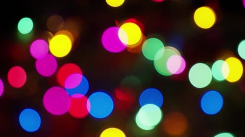 Abstract Bokeh Lights Shimmering on a Dark Background