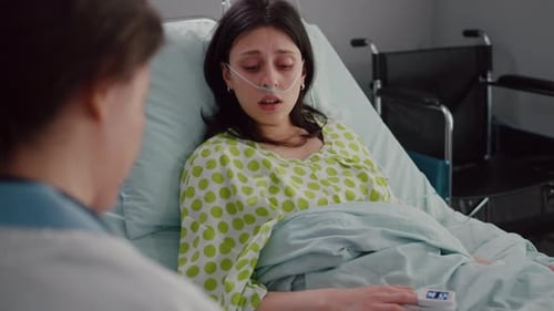 Patient in Hospital Bed Receiving Medical Attention