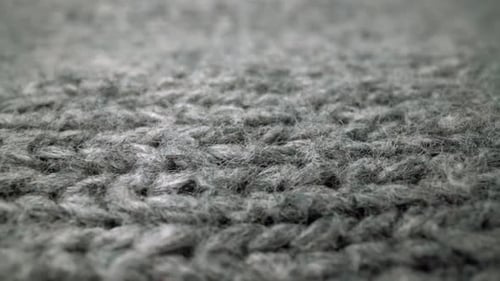 Extreme Detail View of Sheep Wool Cloth Texture Flowing in Macro Dolly Shot