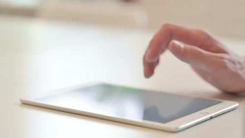 Close Up of Typing on Digital Tablet