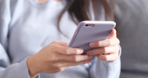 Close up of woman using cellphone