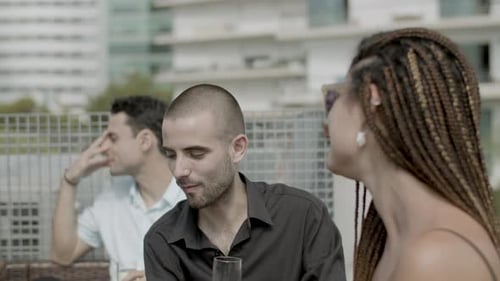 Front View of Happy Businessman Talking with Coworker at Party