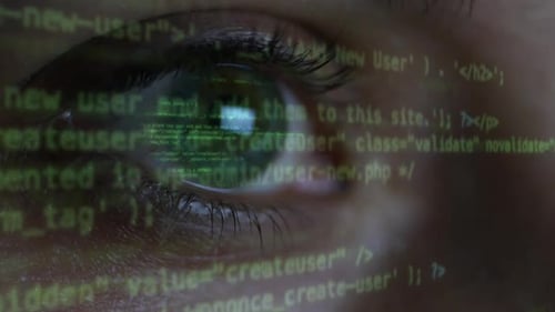 Eye Reflecting Computer Code Overlayed on Frame