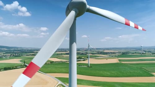 Aerial View of Wind Turbines in Rural Farmland