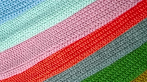 Colorful Knitted Fabrics Arranged Diagonally in Close-Up