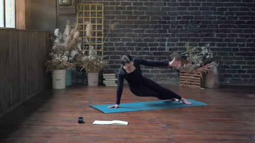 Woman Practicing Yoga Indoor Class