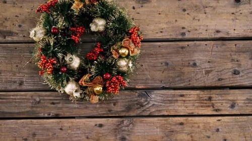 Christmas Wreath on a Rustic Wooden Wall