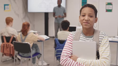 Smiling Student in Classroom at School