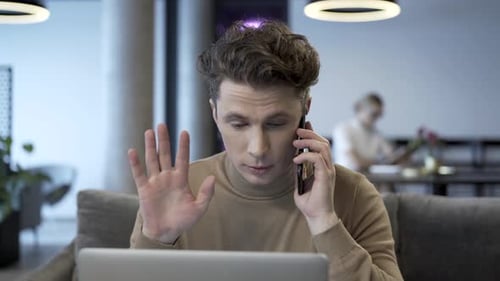 Man on Phone Getting Good News About Business