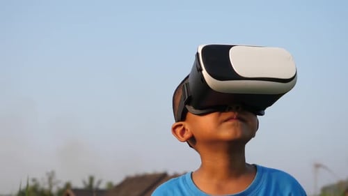 Asian Boy In Virtual Reality Headset