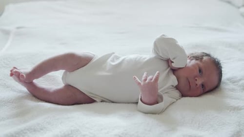 Close-up portrait of a young baby who has recently been born.