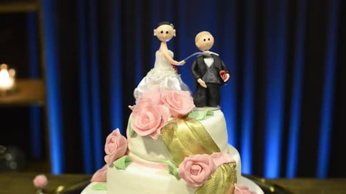 Elegant Wedding Cake with Bride and Groom Toppers