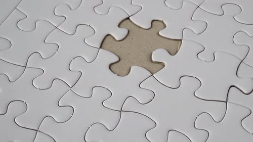 Macro Shot of Incomplete White Jigsaw Puzzle