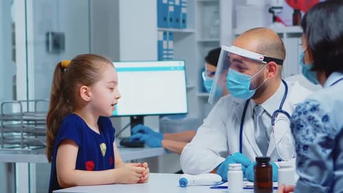 Girl Talking to Doctor in Bright Medical Office