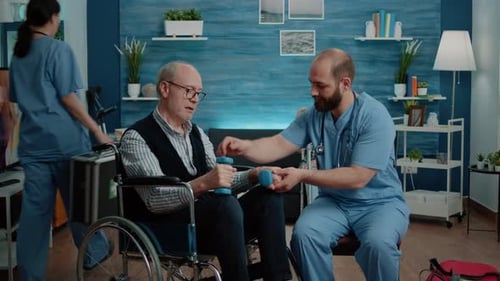 Man in Wheelchair Lifts Weights with Medical Help