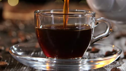 Cup of Freshly Brewed Black Coffee. Closeup Side View