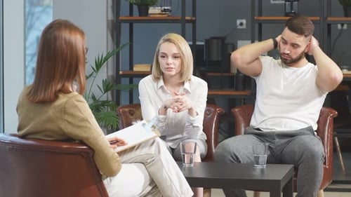 Couple at Counseling Session with Female Therapist