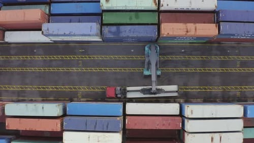 Loading Cargo Container on Transport Truck