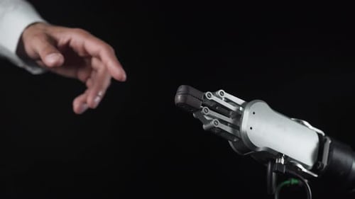 Human Hand Touching a Robotic Hand
