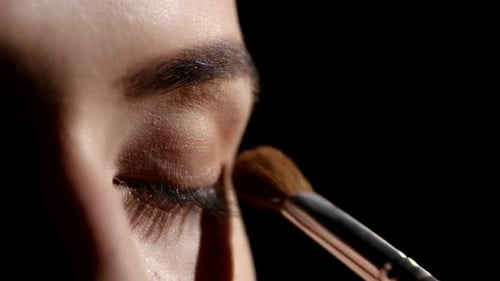 Artist Applying Eyeshadows. Black. Makeup. Closeup