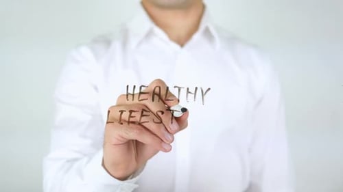 Man Writes Healthy Lifestyle with Marker